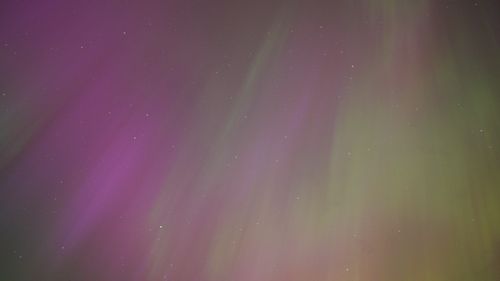 Free Captivating view of northern lights illuminating the night sky in vibrant colors. Stock Photo