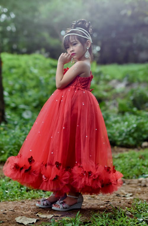 Free Selective Focus Photography Of Standing Girl In Red Dress  Stock Photo