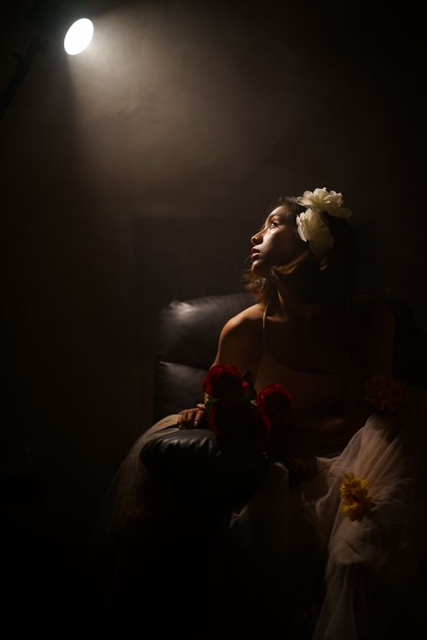 Portrait with flowers in low light by Steven Knigth07 on Pexels