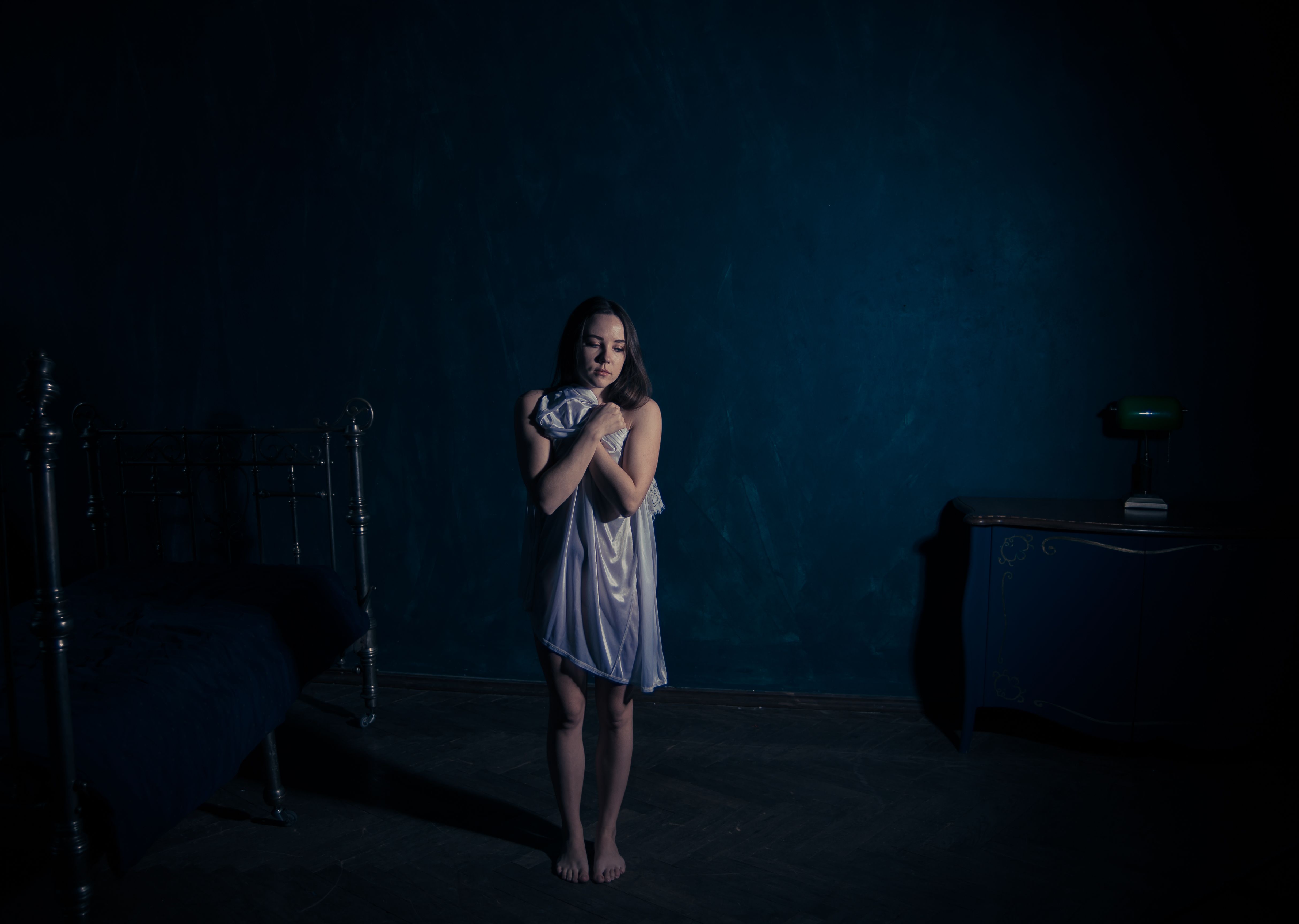 Moody Portrait of Woman in Dark Room · Free Stock Photo