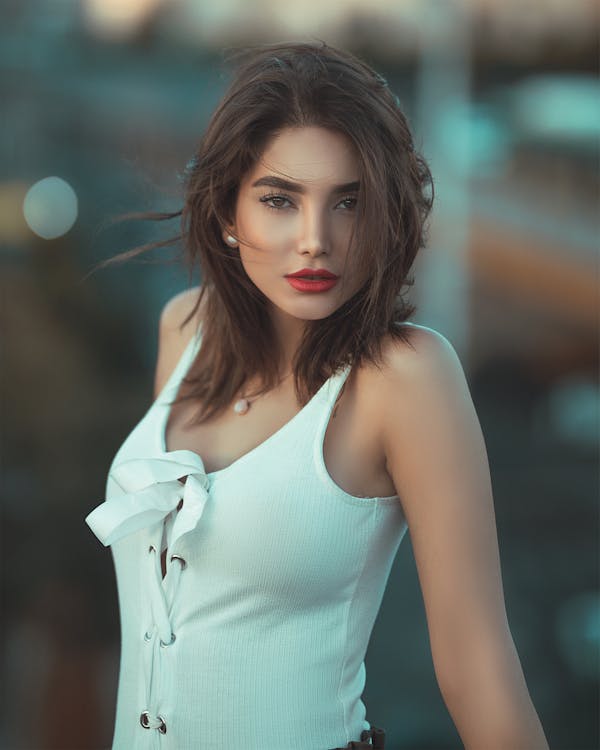 Free Women Wearing White Tank Top Posing for a Photo Stock Photo