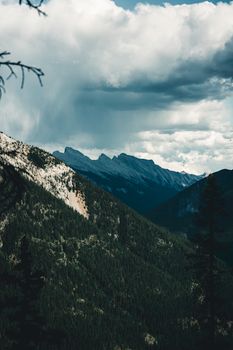 Scenic view of clouds over the Rocky Mountains in Banff, Canada.