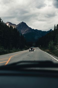 Experience a tranquil drive through the majestic Jasper National Park with mountain views.