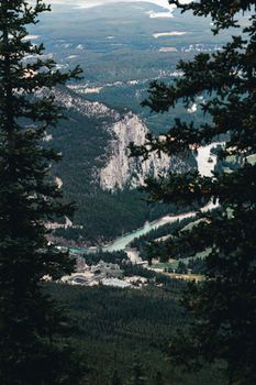 A breathtaking aerial view of Banff National Park with mountains and forests.