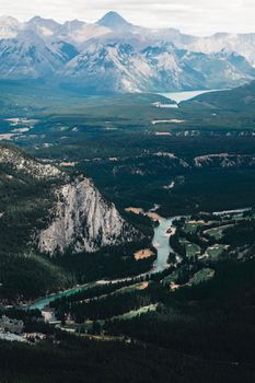 Stunning aerial view of mountains and rivers in Banff National Park, capturing nature's beauty.