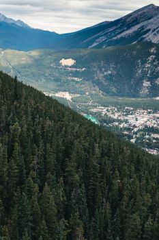 A breathtaking aerial view of Banff National Park showcasing dense forests and distant mountains.
