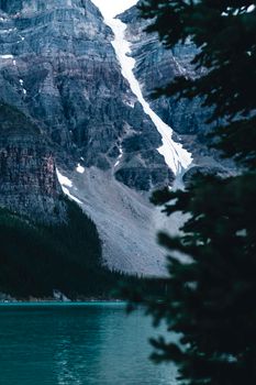 Scenic view of mountainous landscape and pristine lake in Banff National Park, Alberta, Canada.
