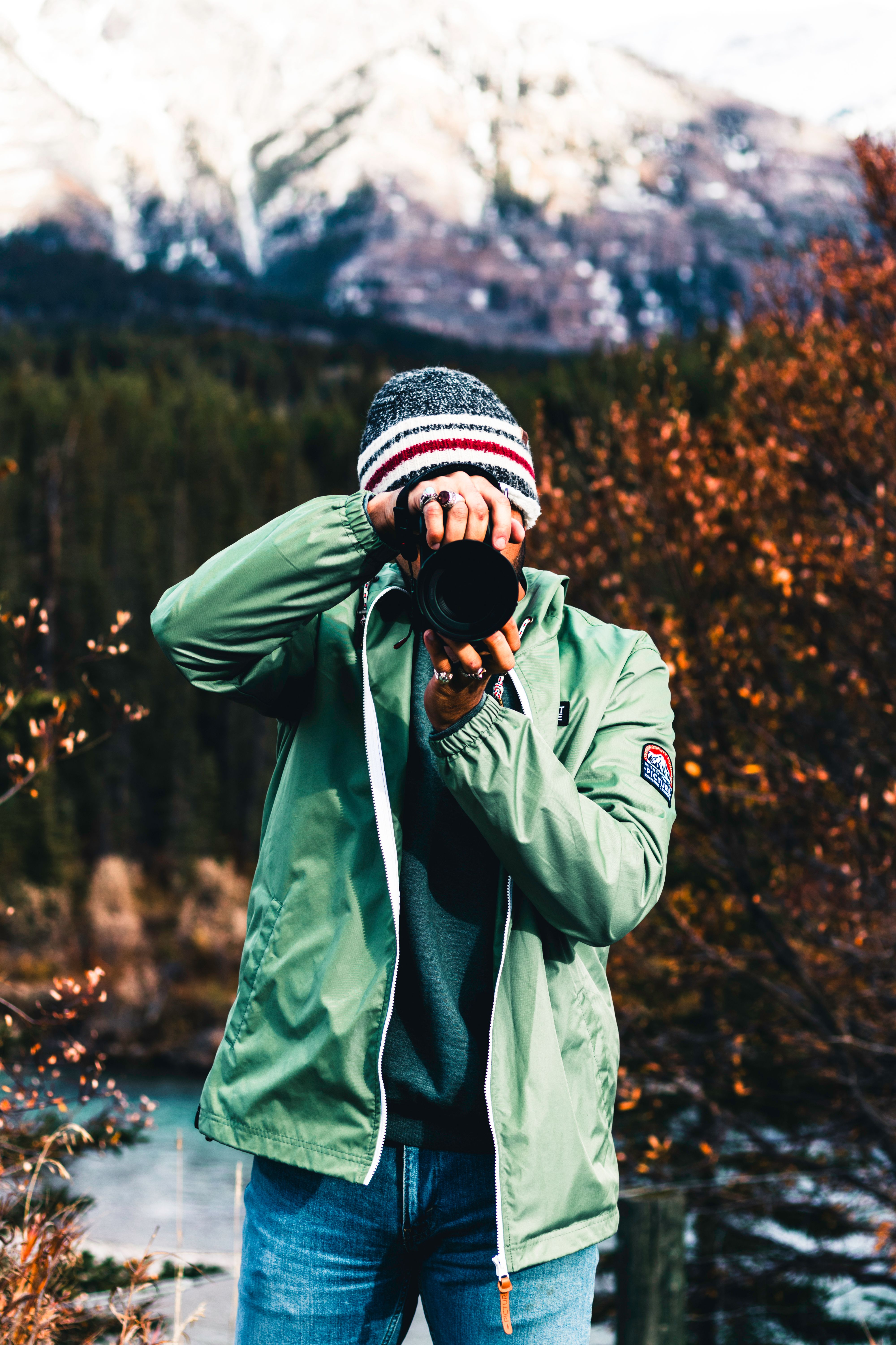 A person capturing the beauty of Jasper National Park during fall.
