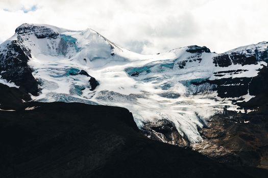 Breathtaking view of a glacier-covered mountain in Jasper National Park, Canada.