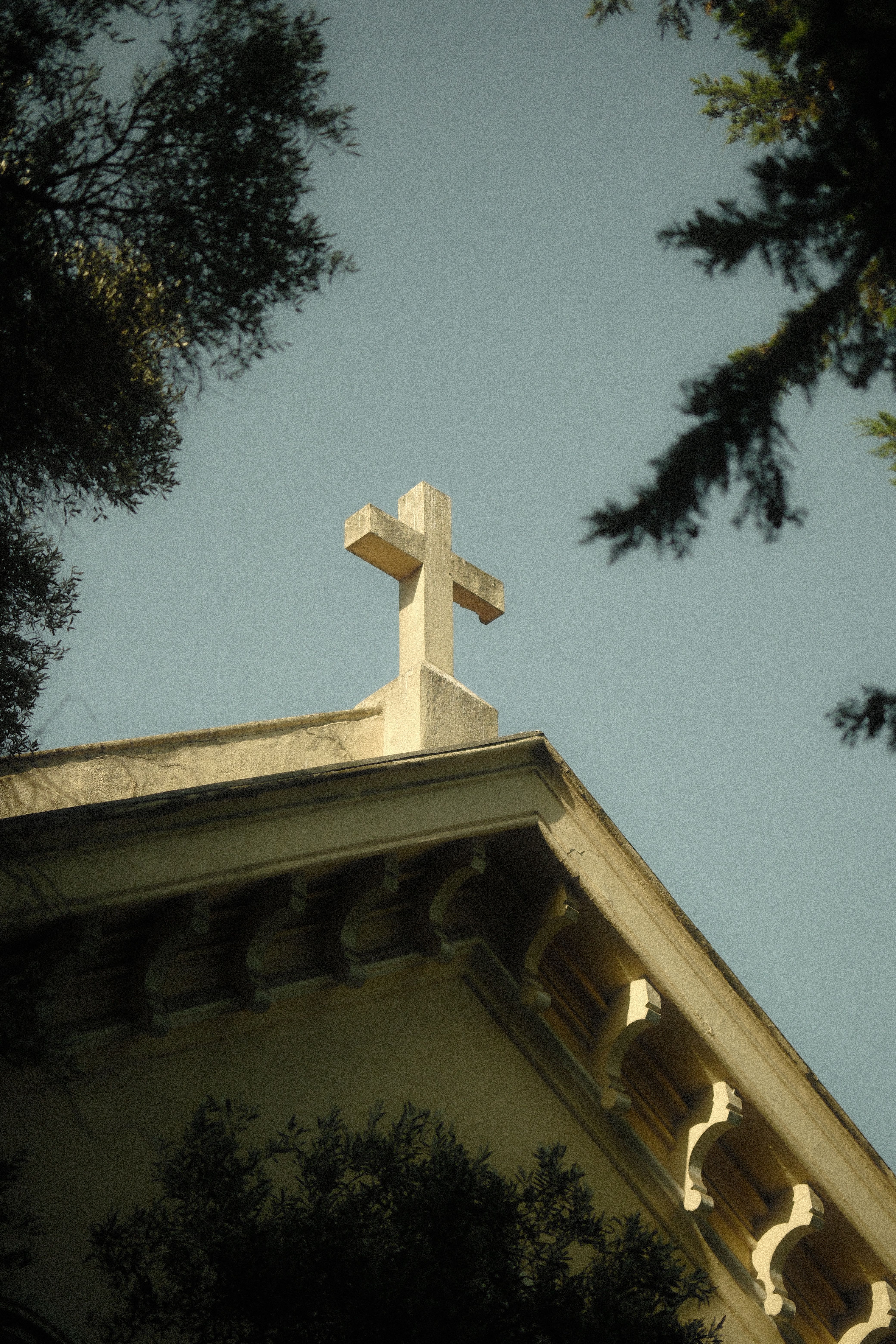 historic-church-roof-with-cross-against-sky-free-stock-photo