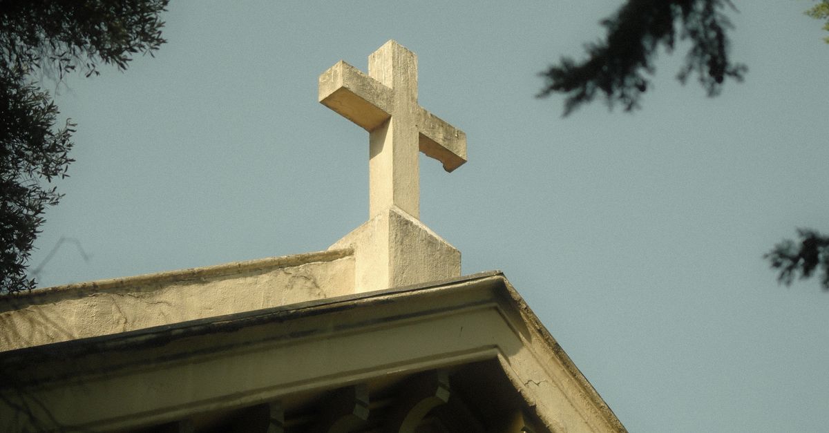 Historic Church Roof With Cross Against Sky Free Stock Photo historic-church-roof-with-cross-against-sky-free-stock-photo