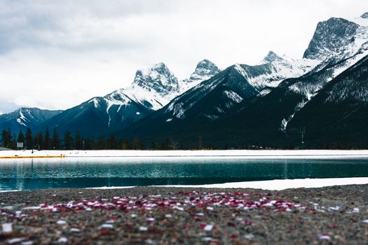 A breathtaking view of snow-capped mountains and a tranquil lake in Glacier, BC.