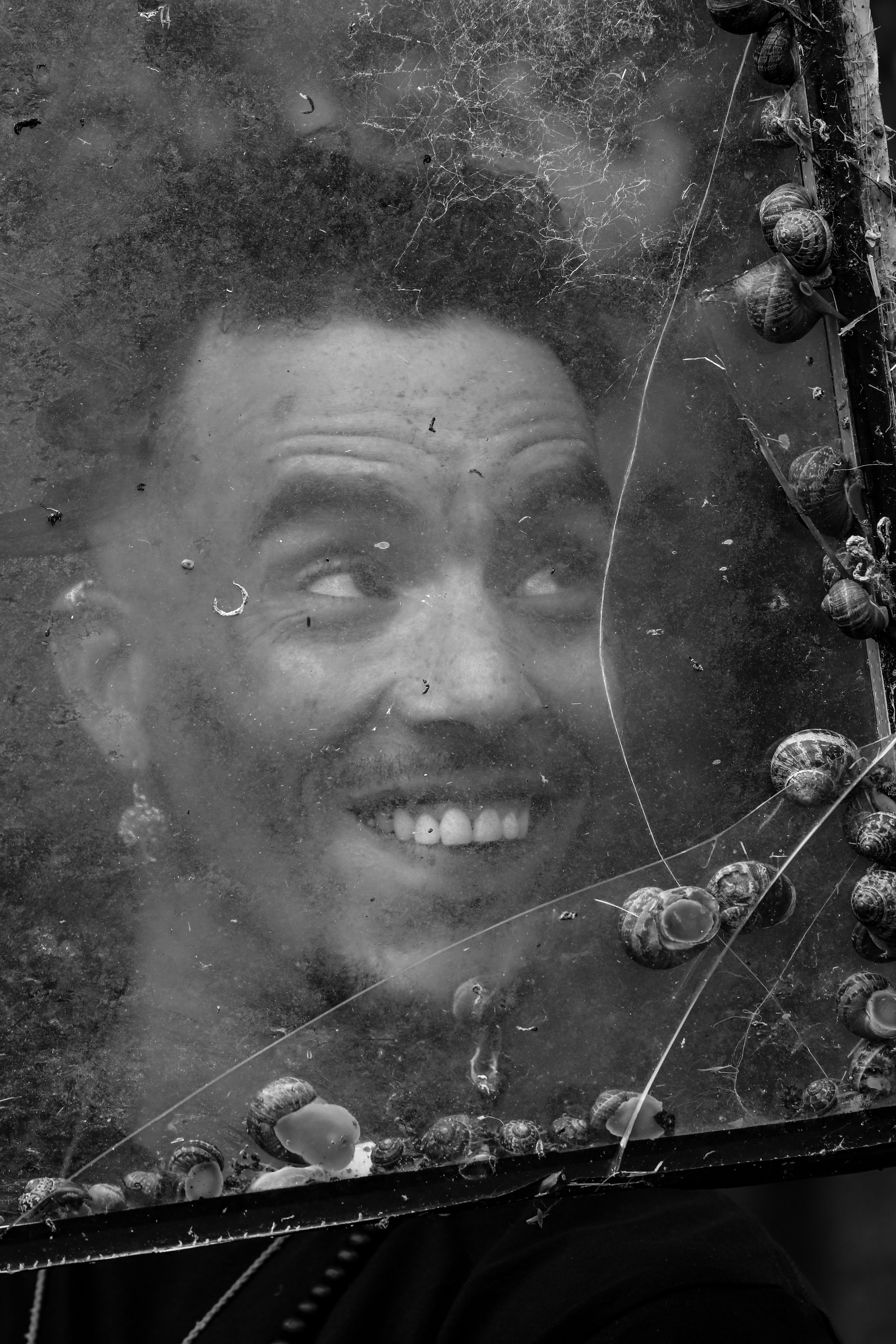 Smiling Man Behind Old Window · Free Stock Photo