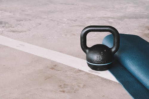 Free Kettlebell And Yoga Mat Stock Photo