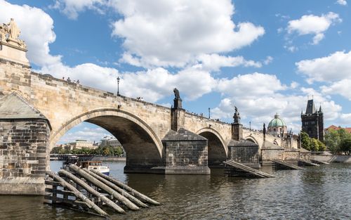 Free Explore the historic Charles Bridge crossing the Vltava River in Prague, Czech Republic. Stock Photo