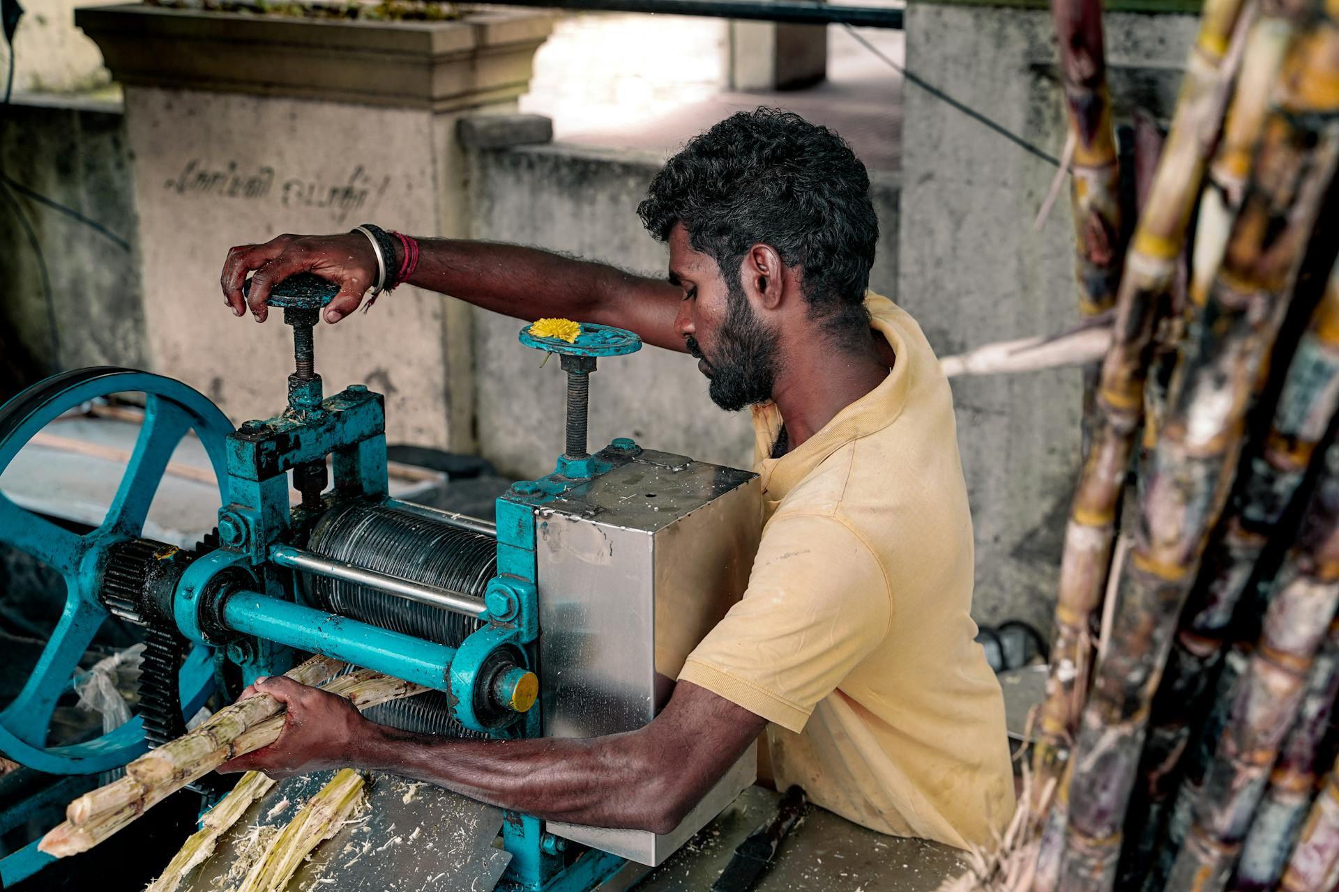 Street Vendor Extracting Sugarcane Juice in Chennai