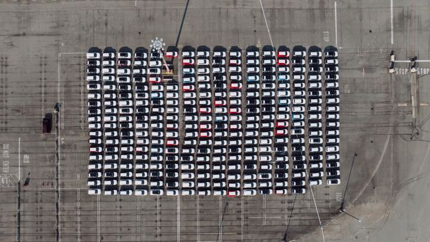 Aerial shot of an organized parking lot filled with cars in Seattle, WA.