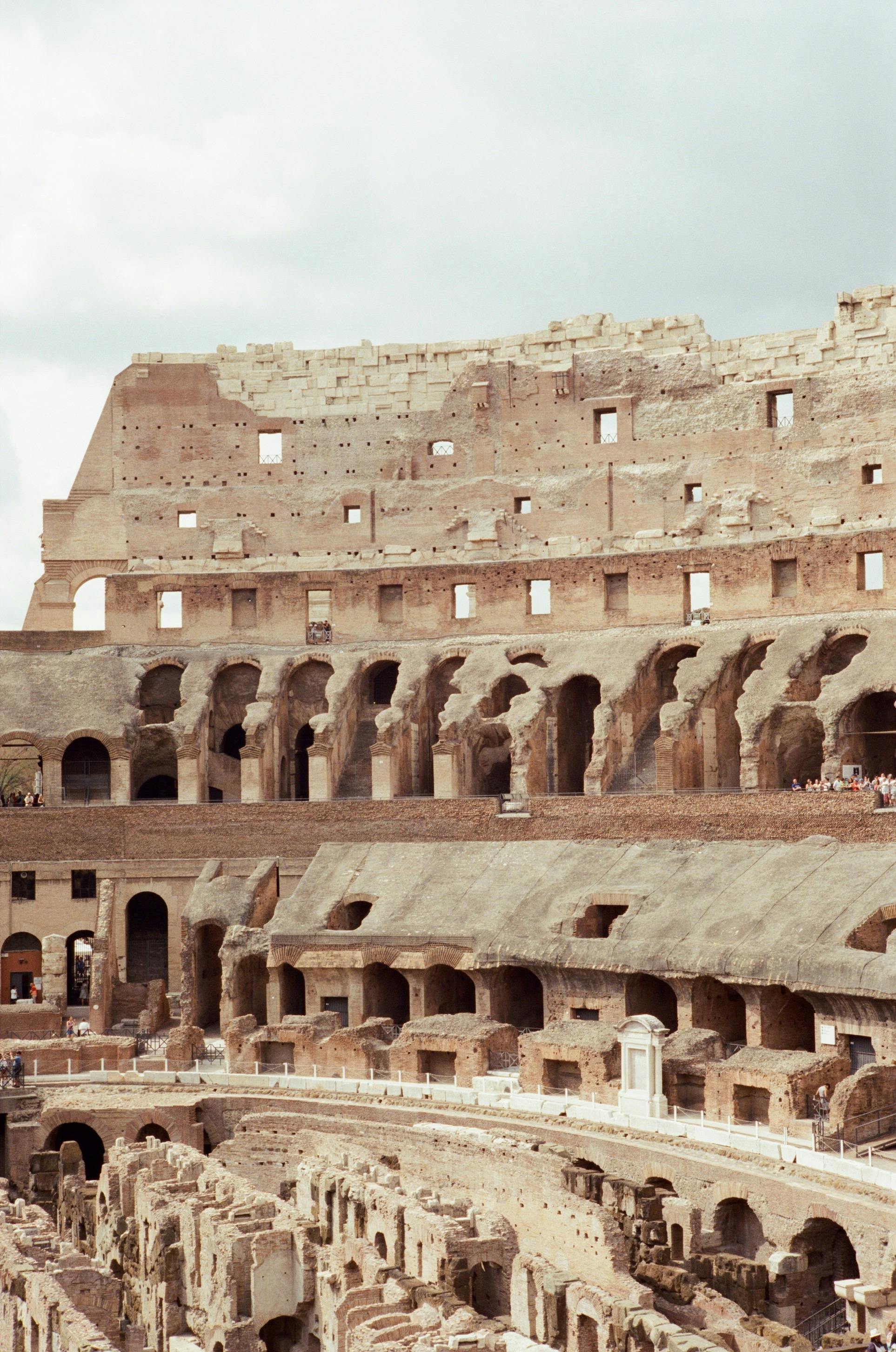 Detailed view of the ancient Colosseum in Rome, Italy showcasing its historic architecture.