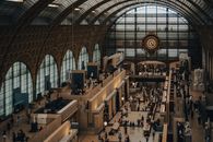 A captivating view inside the Musée d'Orsay, featuring its iconic clock and bustling visitors.