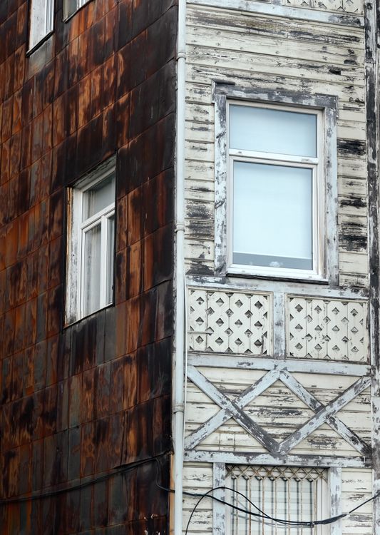 Rusty Front Building A building with a rusty exterior and windows · Free Stock Photo