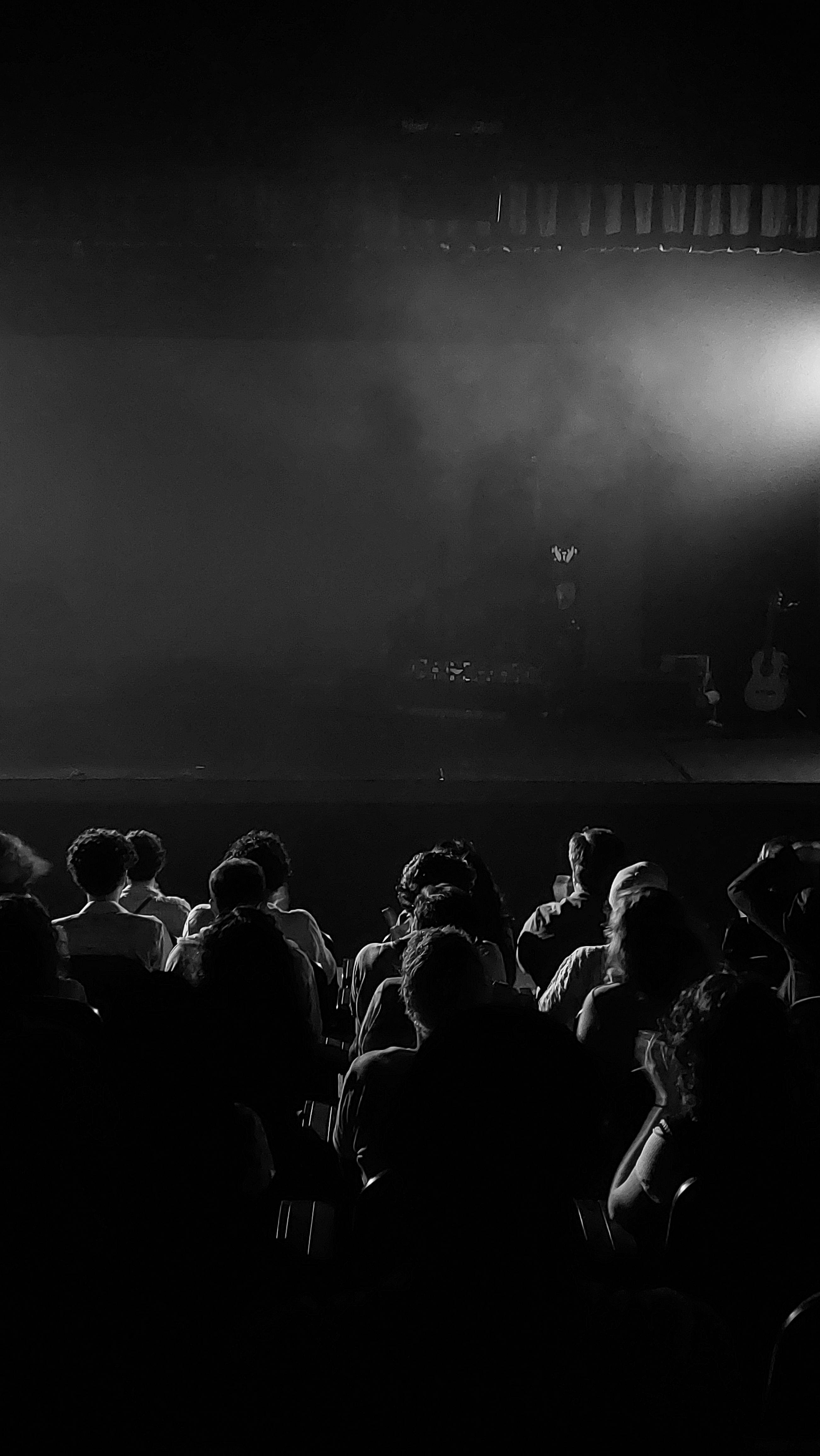Free A theater audience immersed in a mysterious stage performance in Campina Grande, Brazil. Stock Photo
