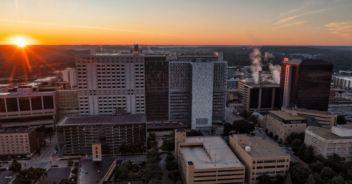 Aerial view of Rochester, Minnesota's skyline at sunset, showcasing modern architecture.