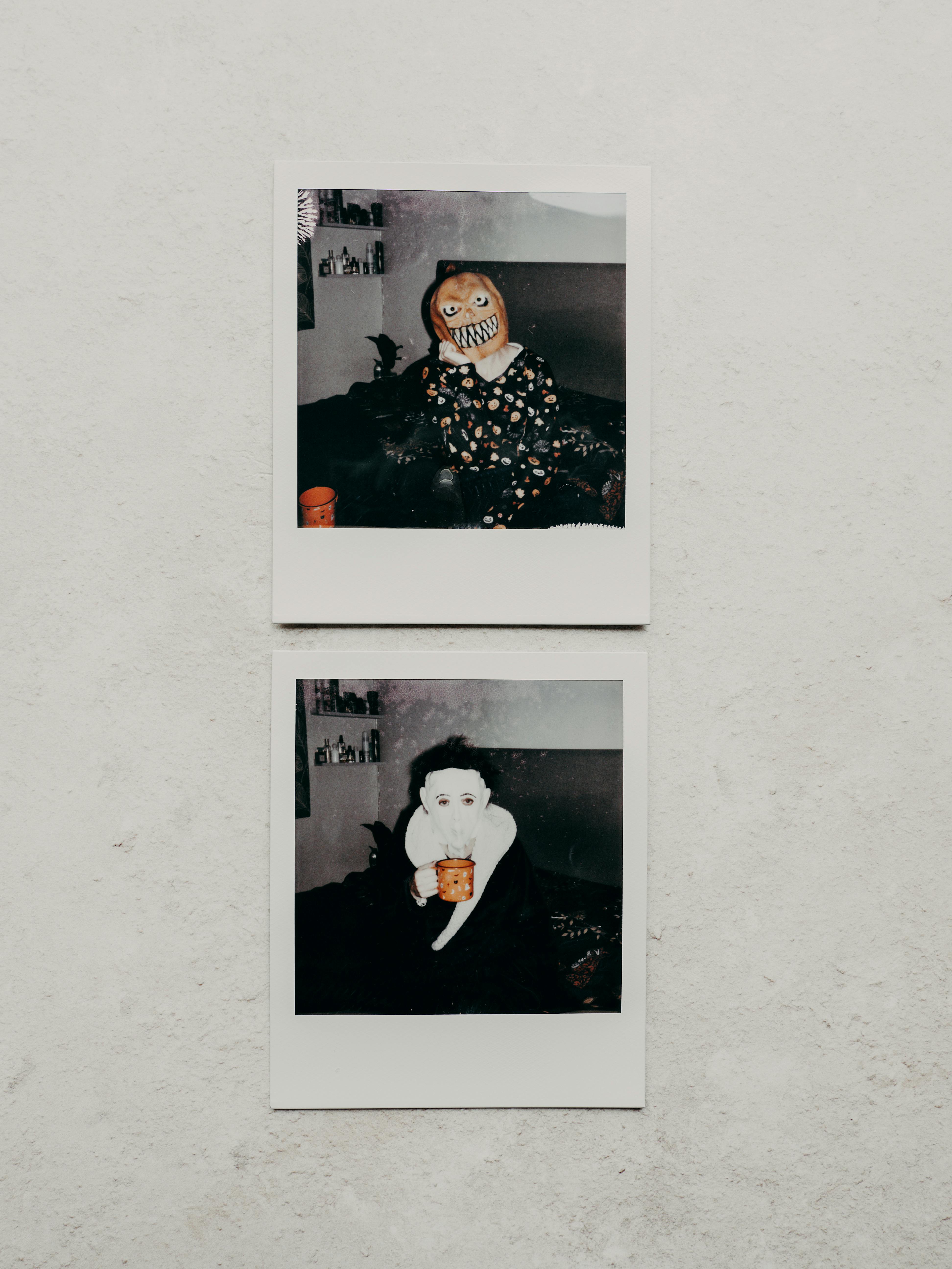 Two vintage-style Polaroid photos featuring Halloween costumes on a textured surface.