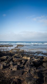 Scenic view of the rocky shoreline at Playa de las Américas, Spain.