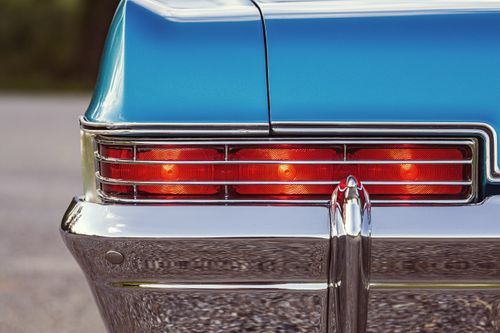 Free Close-up of a 1966 Chevrolet Caprice with a shiny blue exterior and rear taillights. Stock Photo