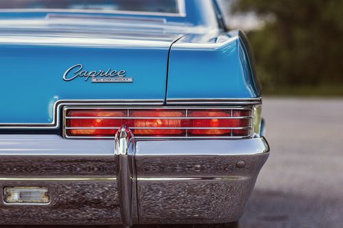 Free Close-up of a blue 1966 Chevrolet Caprice showcasing classic vintage details and tail lights. Stock Photo