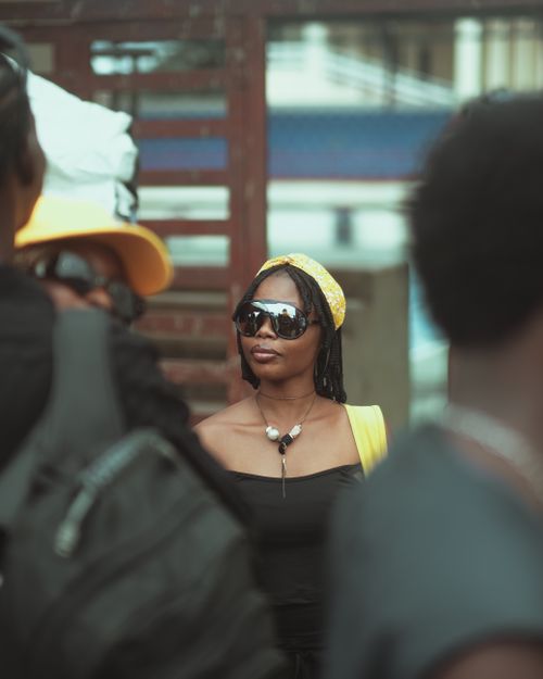 Free Stylish woman captured in a vibrant street scene in Ibadan, Nigeria. Perfect for fashion and lifestyle themes. Stock Photo
