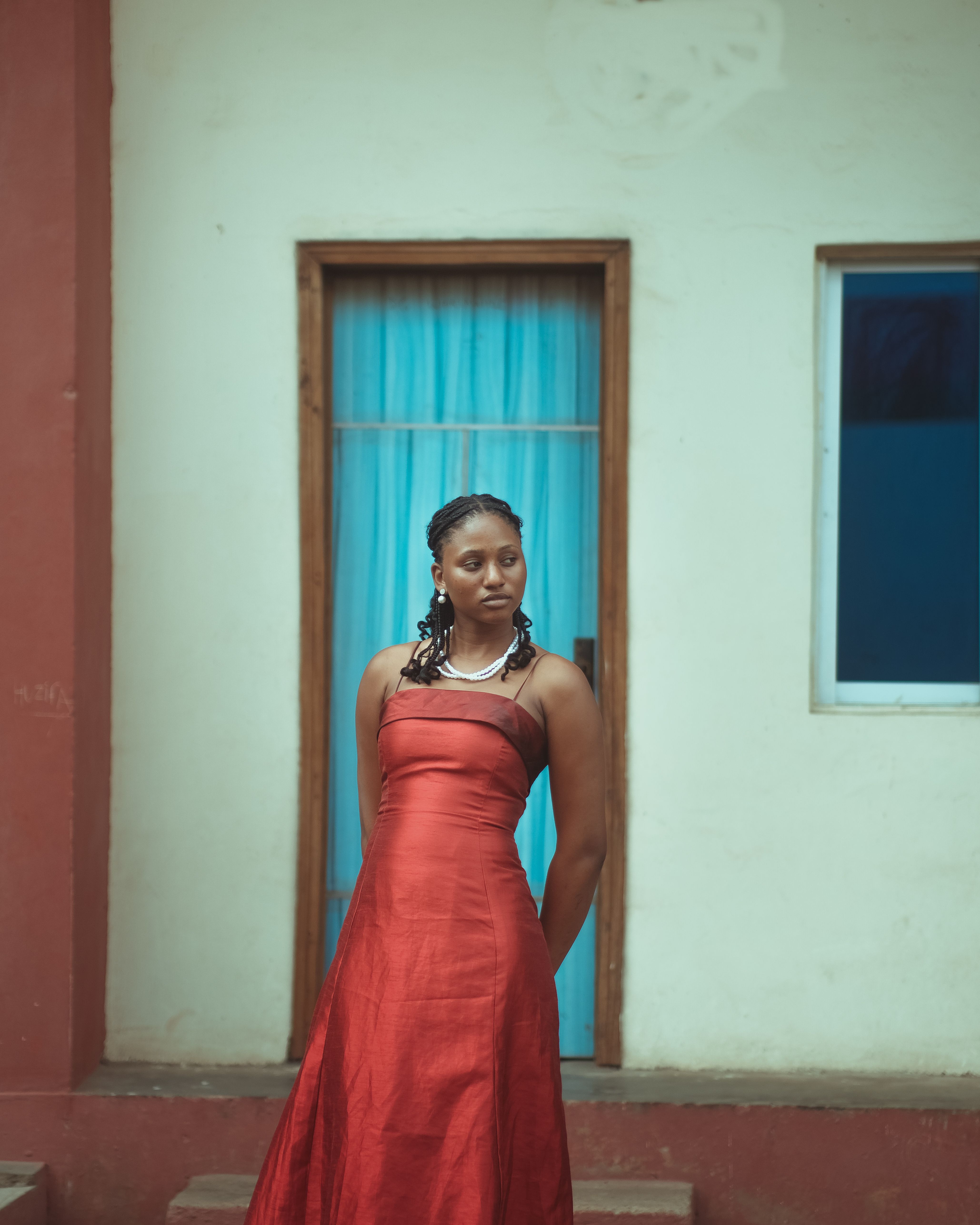 A woman in a red dress standing outside · Free Stock Photo