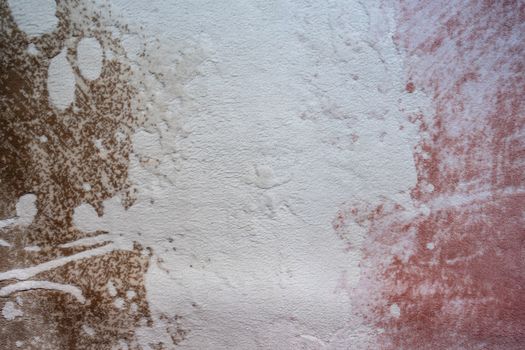 Abstract image featuring a textured surface with brown and pink tones.