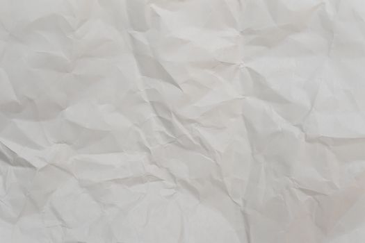 High-resolution image of crumpled white paper, perfect for backgrounds and design projects.
