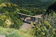 A bridge over a river in the mountains