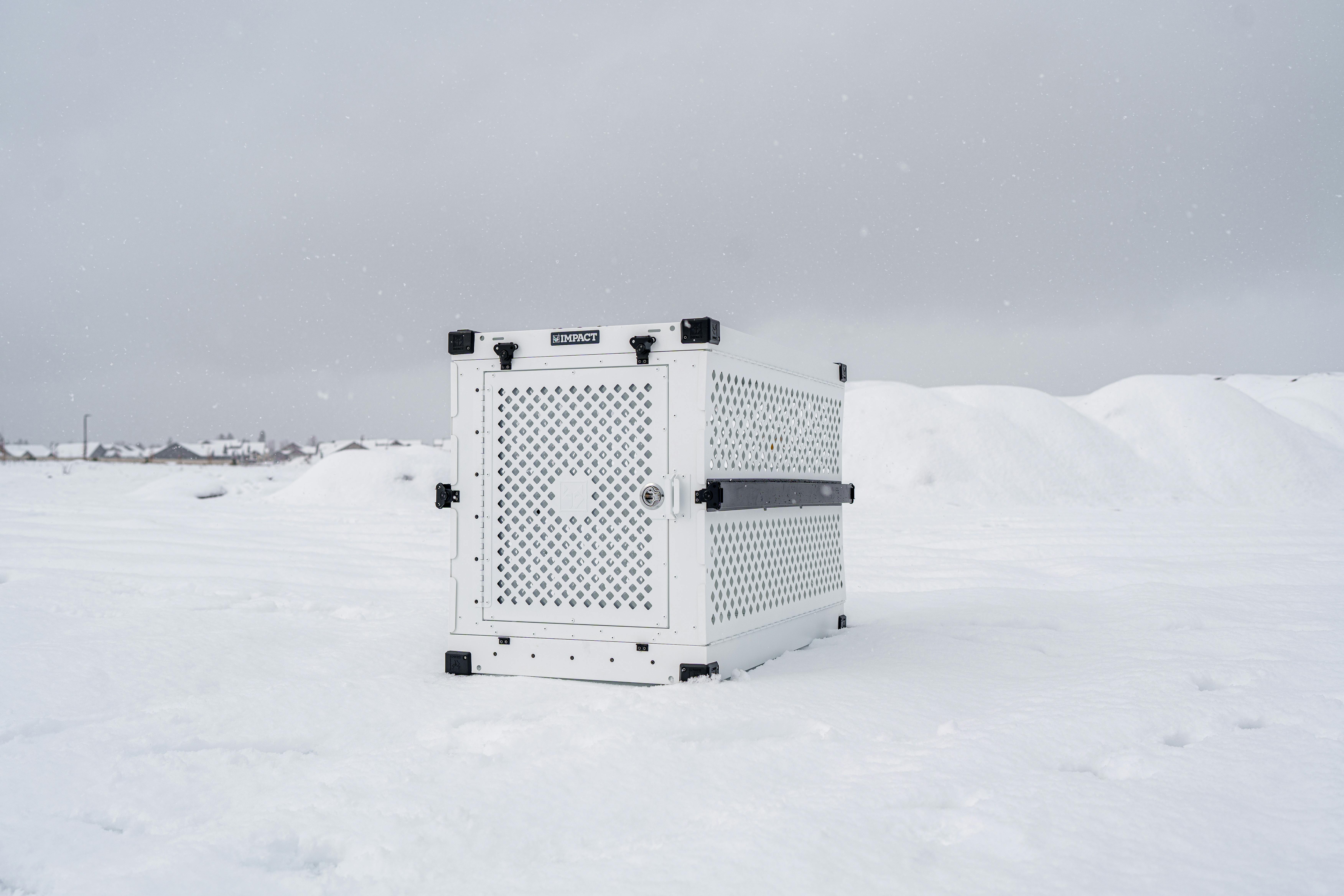 siberian husky and owner in winter featuring impact dog crate