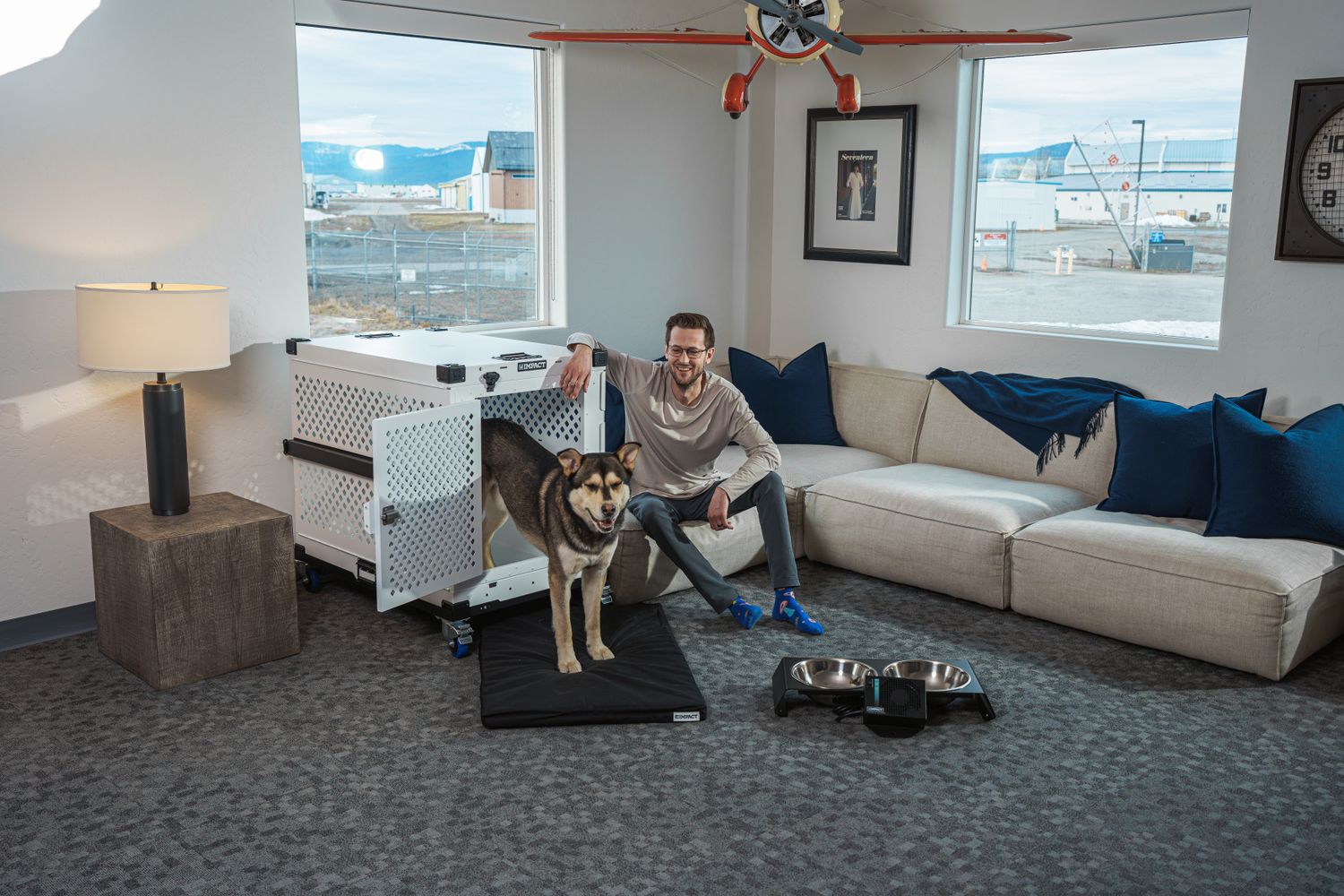 Pet owner relaxing with a dog in a thoughtfully arranged home