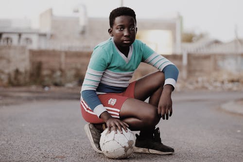 Boy in Green and White Striped V-neck Long-sleeved Shirt