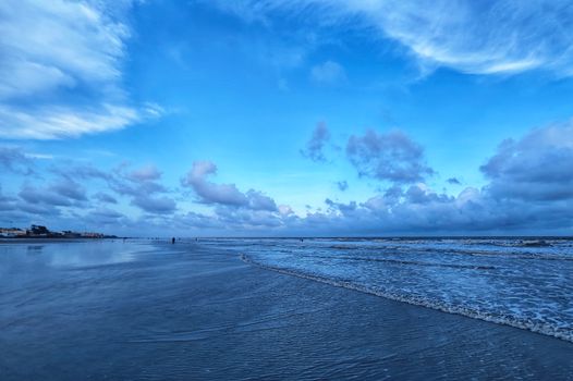 Relaxing seascape at Mandarmani beach, West Bengal, showcasing tranquil waves under a bright sky.