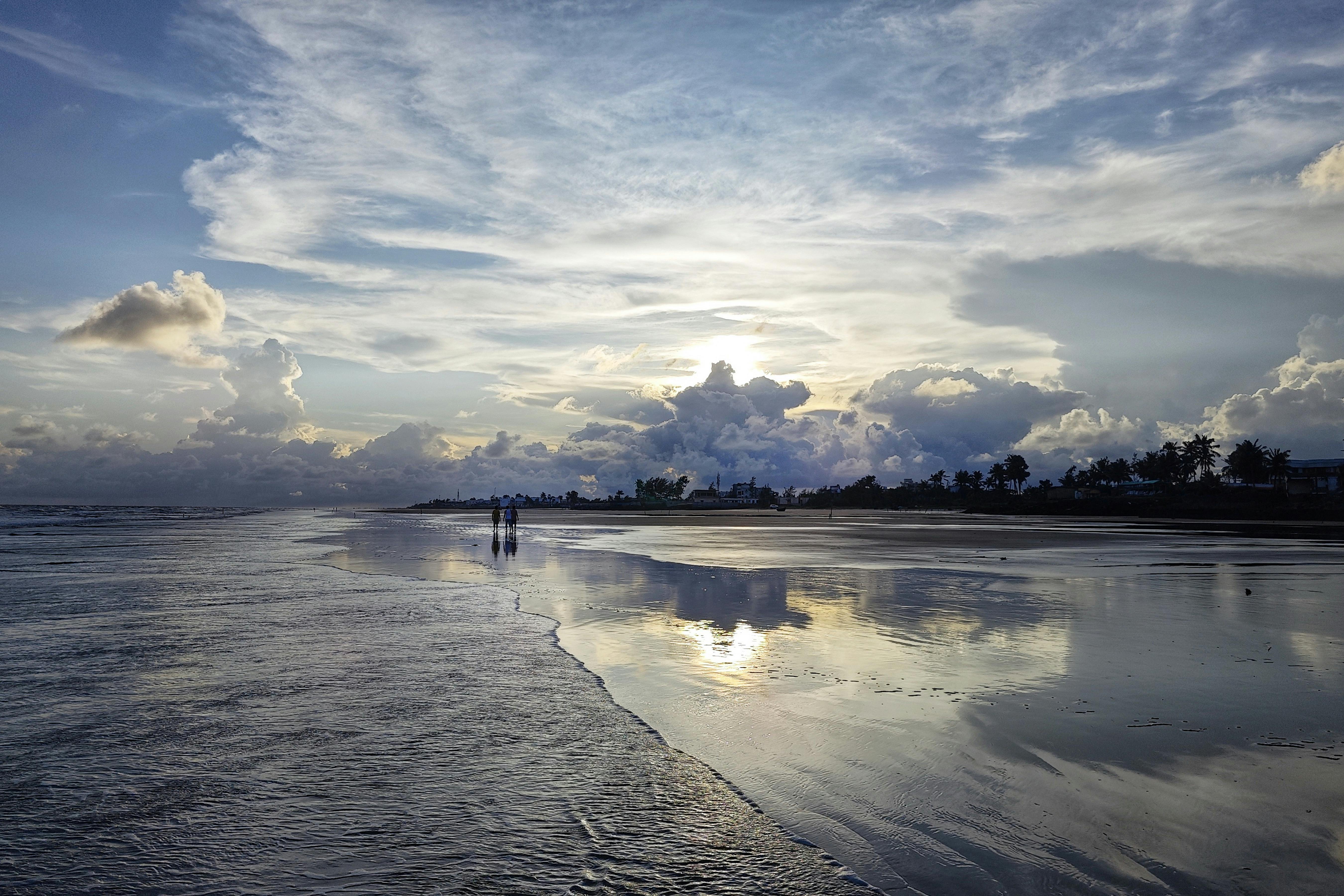 Beautiful beach sunset with reflections at Mandarmani, India. Ideal for travel and nature enthusiasts.