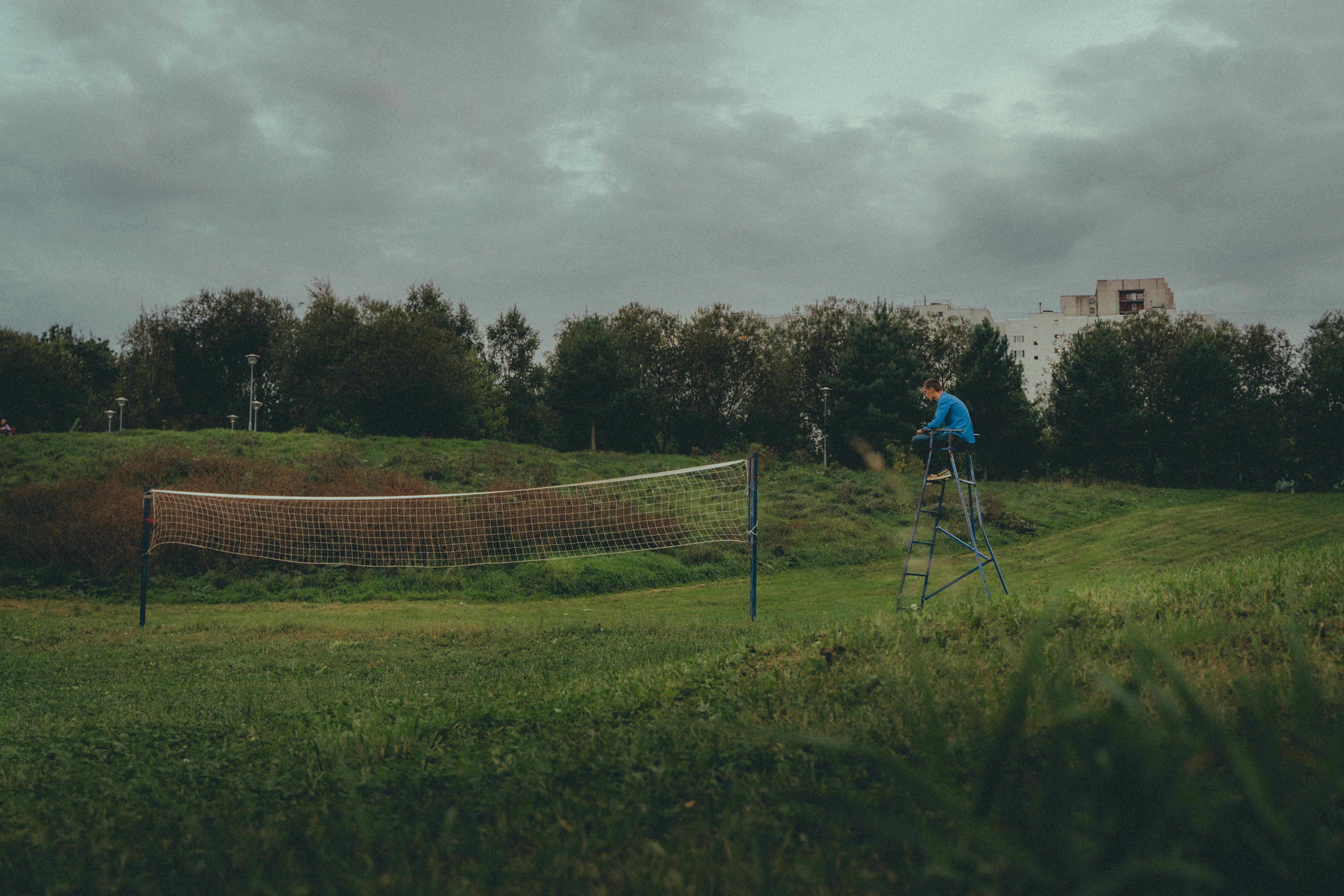 A tranquil volleyball court in a lush Moscow park, perfect for a peaceful day outdoors.