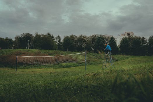 A tranquil volleyball court in a lush Moscow park, perfect for a peaceful day outdoors.