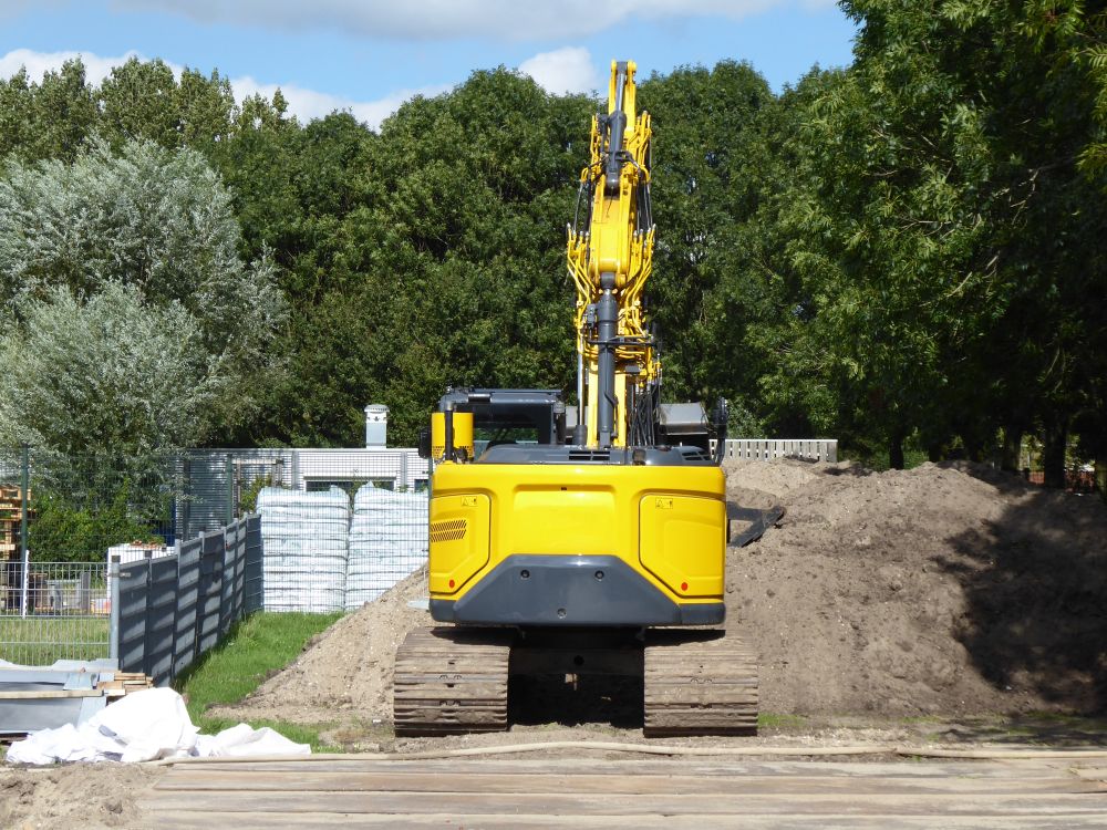 Land clearing equipment preparing a wooded property