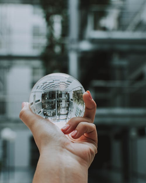 Person Holding Round Clear Ball