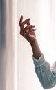 Crop woman with raising hand on white background