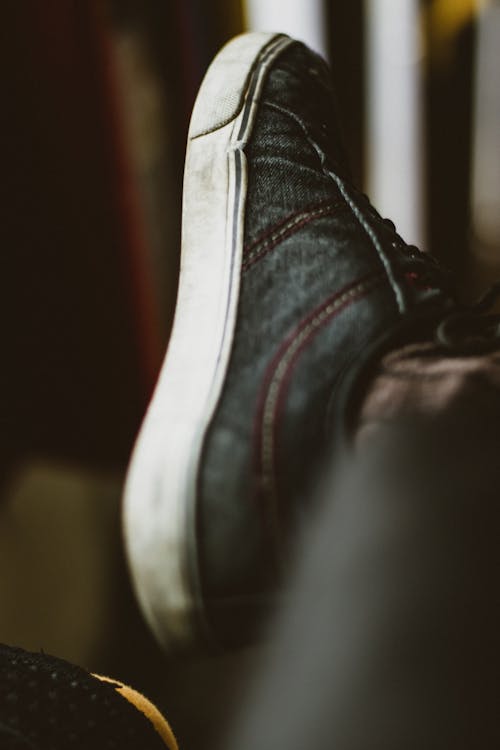 Free Person Wearing Black and White Low-top Sneaker Stock Photo