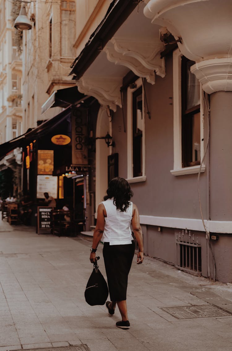 Woman Holding Black Bag