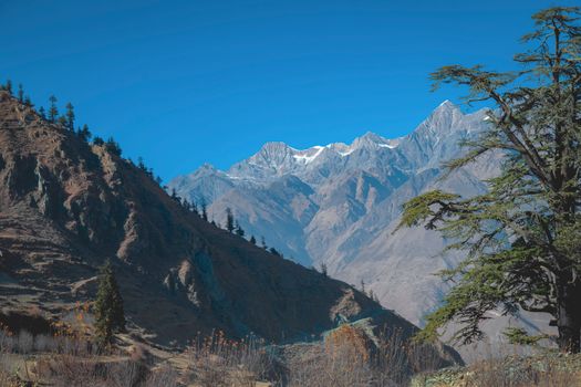 Breathtaking view of the Himalayan mountain range with clear blue skies in Nepal.