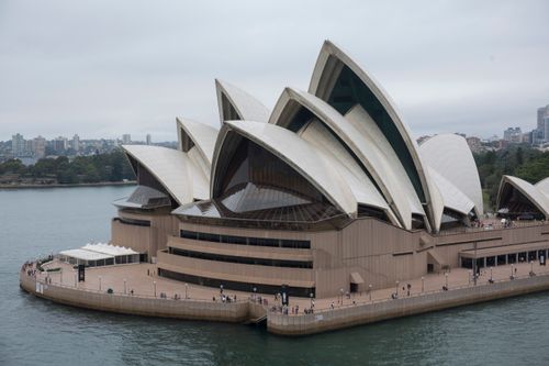Free A breathtaking view of the Sydney Opera House with overcast skies, showcasing its iconic architecture. Stock Photo