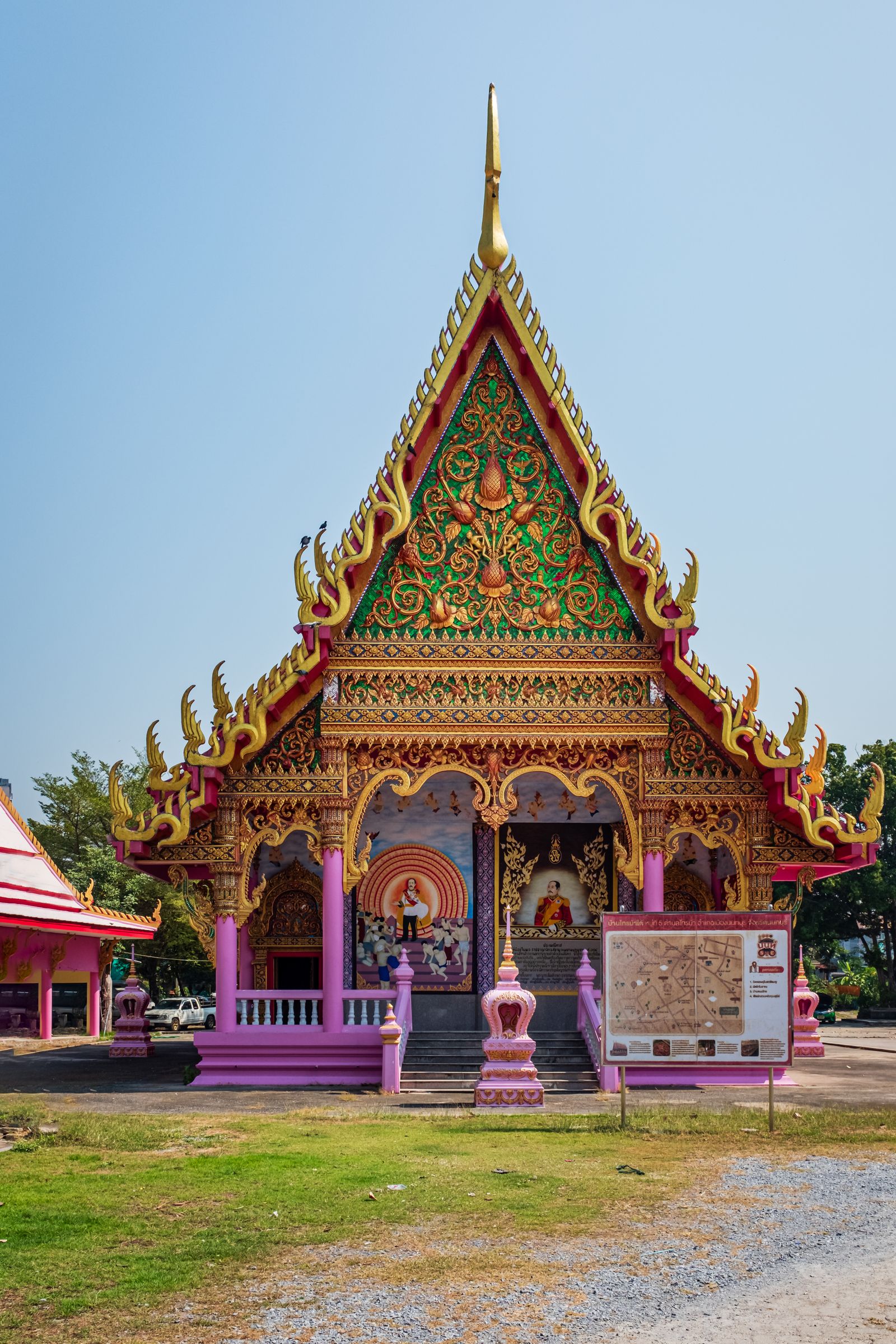 Colorful Buddhist temple facade in Nonthaburi, Thailand showcasing intricate architecture.